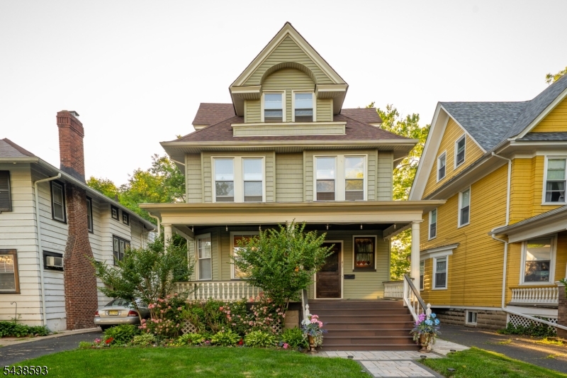 Beautiful Victorian offering timeless charm, generous living space, and exceptional indoor/outdoor living. A welcoming front porch sets the tone, while the updated kitchen and baths, hardwood floors, and two fireplaces add warmth and character throughout. The finished walk-up attic with a full bath and finished basement provide flexible living space for guests, recreation, or a home office.Step outside to your private backyard retreat backing directly to Soverel Park, creating a peaceful and scenic setting. Enjoy entertaining on the expansive 9x21 maintenance-free deck overlooking mature trees and seasonal blooms. The backyard also features a 16x30 concrete patio with a gazebo, fire pit area, synthetic turf for low-maintenance enjoyment, and a charming Devon bench, making it the perfect space for relaxing or hosting gatherings. Detached garage and incredible indoor/outdoor living complete this exceptional home.