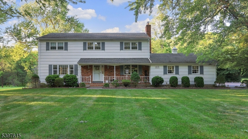 Welcome to this 4 bedroom, 2.1 bath Colonial nestled on a picturesque 1.5-acre property. Offering approximately 2,300 square feet of living space, this spacious home combines timeless charm with everyday comfort. The inviting curb appeal features mature landscaping, a covered front porch, and an expansive front lawn set back from the road for added privacy. Inside, the sun-filled layout offers generously sized rooms, hardwood flooring, and a seamless flow ideal for both daily living and entertaining. The updated eat-in kitchen showcases custom cabinetry, ample counter space, and a bright dining area overlooking the grounds. The warm and welcoming family room is highlighted by a brick fireplace, creating the perfect gathering space. Formal living and dining rooms provide additional flexibility for entertaining. Upstairs, spacious bedrooms offer comfort and functionality, while the home's thoughtful layout accommodates a variety of lifestyles. Gas generator included. Enjoy peaceful outdoor living with a sprawling backyard surrounded by mature trees, offering endless possibilities for recreation, gardening, or future enhancements. Additional highlights include an attached 2 car garage, abundant storage, and pride of ownership throughout. Ideally located near top-rated schools, parks, shopping, dining, and major commuter routes, this exceptional property presents an opportunity to enjoy the best of Warren Twp living.