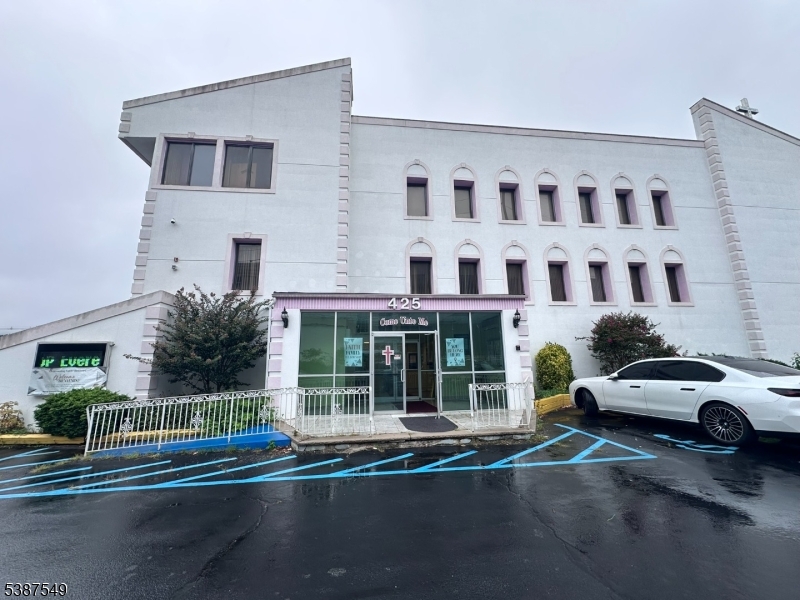 Modern style building zoned for special purposes on over half an acre. Features 80 parking spaces in fenced in area. Separate office building included in sale. 32 pews accommodating 340. Raised platform for choir and parishioner. Baptismal pool and changing room. Multi levels with offices, kitchen, full sized dining area and passenger elevator. Loading dock.