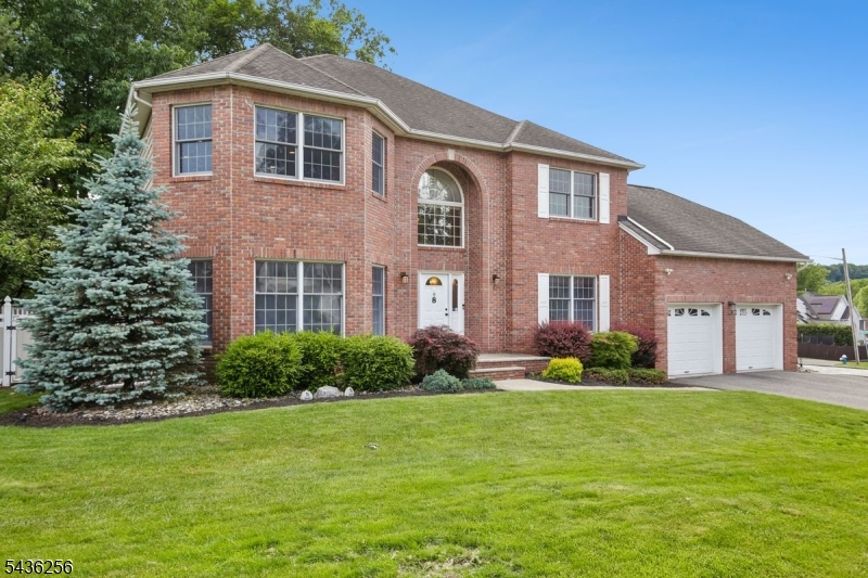 This beautiful 5-bedroom, 3.1-bath Colonial offers timeless elegance, exceptional space, and everyday functionality. A dramatic two-story foyer sets the tone upon entry, opening to gracious formal living and dining rooms ideal for entertaining. At the heart of the home, the expansive eat-in kitchen flows seamlessly into the warm and inviting family room, creating the perfect setting for everyday living and gathering.A versatile first-floor office/bedroom provides flexibility for guests or your work-from-home needs, while a proper mudroom off the attached two-car garage keeps daily routines organized with ease. Upstairs, the dual-entry staircase leads to three generously sized secondary bedrooms and an expansive primary suite offering abundant space to relax and unwind.The finished basement adds even more living space with a large recreation room and versatile bonus area, ideal for a gym, playroom, media lounge, game room, or hobby space. Step outside to a private backyard retreat, where a beautifully crafted paver patio sets the scene for summer barbecues, morning coffee, al fresco dining, and more.All of this just a stone's throw from Blue Ribbon-winning Redwood Elementary School and conveniently close to NYC transit, shopping, Montclair, and Verona offering an outstanding location and an elevated lifestyle.