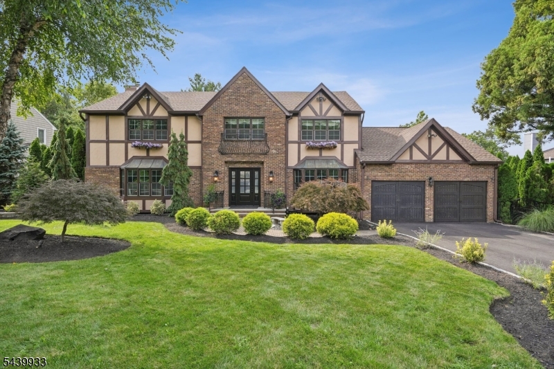 This stunning 5 bedroom, 3.5 bath custom colonial nestled in sought after Cinnamon Ridge section of Berkeley Heights blends timeless craftsmanship with modern luxury. Designed for seamless entertaining and comfortable everyday living with enduring value. This home provides comfort and functionality featuring a first-floor en-suite, a chef's kitchen beautifully appointed with granite countertops, SS appliances, Wolf range and oven, with center island creating the perfect space for everyday living. A fully finished basement with 9-foot ceilings offers an expansive recreation room, game room, gym area and storage room. . The primary luxe bath delivers a spa-like experience with a freestanding soaking tub, oversized rainfall shower, and custom walk-in closet with built-ins. The resort-style backyard is a private oasis complete with a spacious veranda, custom railing, heated gunite pool spanning over 30 feet wide with three dramatic waterfalls, a masonry stone fireplace, brick pizza oven, and unobstructed sunset views. More than 250 mature arborvitae form a lush 16-foot natural privacy hedge amid professionally designed landscaping. Don't miss the opportunity to own this exceptional home that combines elegance, comfort, and convenience. Just minutes from NYC train stations, top-rated schools and vibrant downtown.
