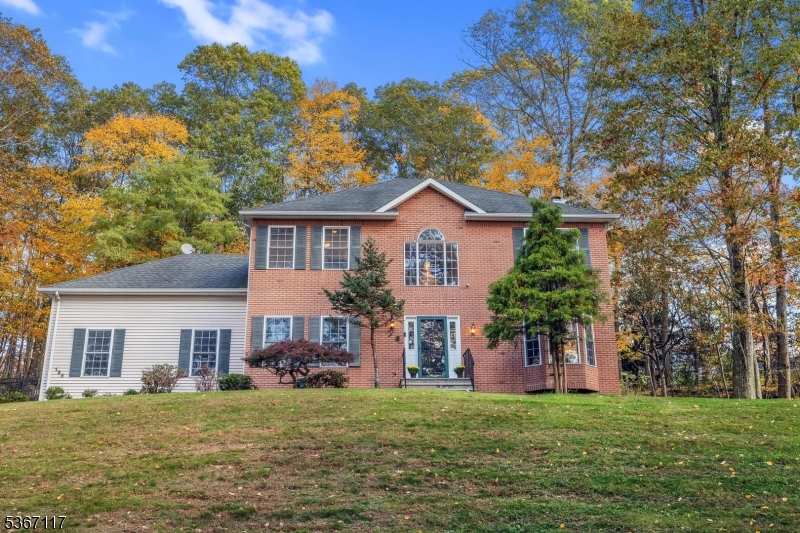 Just minutes to Mt. Olive High School, Rt. 206, shopping and dining is this wonderful colonial on a quiet dead-end street in Flanders.  Situated on 2.25 private and wooded acres, this home features a two story entry foyer, 9' ceilings on first floor, 1st floor office (or formal living room) with hardwood flooring, family room with wood burning fireplace, bookshelves and cabinets.  Kitchen features walk-in pantry, cherry cabinets, granite countertops, center island, breakfast area surrounded by windows, offering natural light, first floor laundry and formal dining room, as well as 1st floor powder room.  Second floor offers primary suite with walk-in closet, recessed lighting and full bath with soaking tub and stall shower.  Spacious additional bedrooms and full bath complete the level, as well as convenient walk-in attic storage!  Full, finished basement has storage room and closets, gym area and additional office.  Multi-zone HVAC, central air, thermal pane windows, heated inground pool, excellent schools, 5 minutes to Rt. 80 and so much more! House is in need of cosmetic TLC - carpeting/flooring, paint, etc., home being sold as-is with no known major defects.