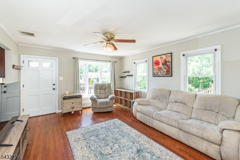 Desirable Lake Parsippany opportunity with lake views! This 2 bedroom 2 full bath ranch offers a functional layout paired with inviting indoor and outdoor living spaces. The kitchen features stainless steel appliances, granite countertops, and updated cabinetry, while hardwood floors add warmth and character throughout the main living areas. The finished basement provides additional flexible living space, perfect for a recreation room, home office, or gym. Outside, enjoy a flat fenced-in backyard complete with a stone paver patio, fire pit, and both front and rear decks ideal for relaxing or entertaining. Conveniently located near lake activities, parks, shopping, dining, and major commuting routes, this home offers the perfect blend of comfort, convenience, and lifestyle.