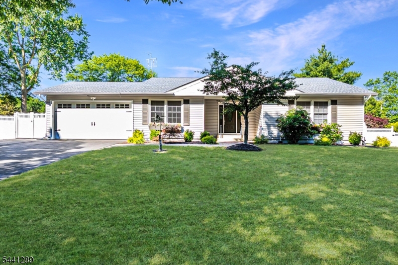 Welcome to the desirable Wood Lake section of Piscataway! This expanded ranch-style home offers 3 bedrooms, 2.5 baths, and a layout designed for comfortable living. A generous foyer welcomes you into the living room, which flows seamlessly into the dining area & updated kitchen. Sliding doors from dining room provide access to the backyard. The kitchen features granite countertops, stainless steel appliances, double oven, built-in microwave, breakfast bar, recessed lighting. Formal living, dining room, family room with custom built-in shelving. Primary suite features a remodeled bath with step-in shower, double vanity, recessed mirrored medicine cabinets, closets, & laundry chute. Second laundry chute is located in the 2nd bath. The partially finished basement includes a private office, half bath, utility sink, built-in storage, washer and dryer, while still offering plenty of additional space with endless possibilities. Major updates include a new roof & furnace(2025), water heater (2024).  Step outside to your own backyard retreat featuring an in-ground pool with solar heating panels, hot tub, covered patio, and three storage sheds. 2 car attached garage provides additional convenience and storage. Located near major highways, shopping, dining, and everyday amenities, with nearby Lake Nelson offering scenic outdoor recreation. This well-maintained home combines space, functionality, and exceptional outdoor living in one of Piscataway's most sought-after neighborhoods.