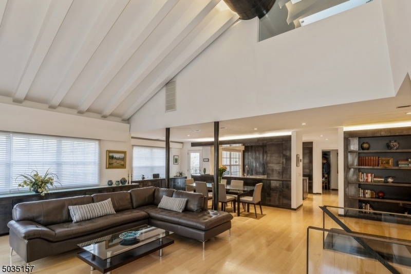 ESCAPE FROM NY. You will be amazed by this SOHO Loft Manhattan style townhouse in the heart of Convent Station.  You will be greeted by a soaring, light filled main level with light, hardwood floors The main level features vaulted Cathedral ceilings with hidden space saving drawers and shelving throughout. Enjoy the minimalist style architecture by famed, award winning Architect David Ling. Chefs Kitchen with gourmet, high end appliances. New sub zero fridge. New LED lights..2 decks. One facing the woods,one with a natural gas barbecue. Ultra private one of a kind unit. Elegant master suite upstairs with huge walk in closet, office and tons of storage closets. Bedroom downstairs with full bath for guest/In Law suite possibilities. Manhattan style living in a SAFE Suburban location.
