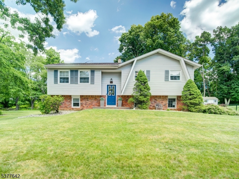 Beautifully maintained and truly move-in ready, this exceptional b-ilevel home is set on a picturesque tree-lined lot that backs directly to Turkey Brook Park, offering a wonderful extension of outdoor living right from your backyard. Thoughtfully updated throughout, the home features a high-efficiency heating system and is wired for generator use for added peace of mind. The sun-filled main level offers an eat-in kitchen with breakfast bar, ample cabinetry, and sliding glass doors leading to a spacious deck overlooking the private yard. A formal dining room, inviting living room with beautiful wood flooring, three generous bedrooms, and full bath complete the first floor. Elegant moldings and tasteful updates add warmth and character throughout. The renovated lower level features a spacious family room with sliders to the patio, fire pit area, and backyard, creating the perfect setting for entertaining or relaxing. An office (or fourth bedroom), updated half bath, laundry room, and abundant storage space provide flexibility for today's lifestyle. Recent updates include new flooring and fresh paint on the ground level. An oversized storage shed, direct access to the park, and a location just minutes from the elementary school, shopping, dining, and major commuter routes make this home an outstanding opportunity. A must-see property offering comfort, convenience, and pride of ownership throughout!