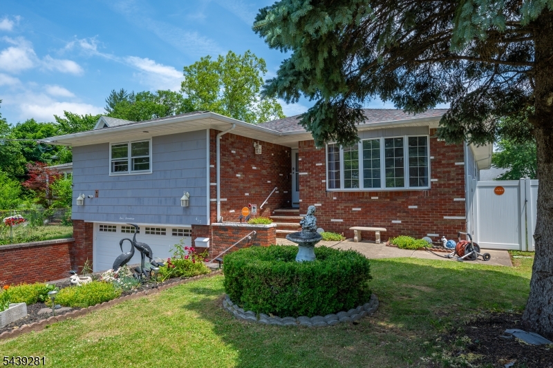 This beautifully updated & exceptionally spacious home offers approx. 3,000 sq. ft. of living space on the main level, providing room for entertaining, relaxation & everyday comfort. The main level features 6 generously sized bedrooms, 3 full bathrooms, including a spacious primary suite. Enjoy a bright and inviting living room, formal dining room, a huge eat-in kitchen with abundant cabinet & counter space, and a versatile den with access to the backyard. Step outside to your private, fenced backyard oasis featuring a swimming pool, perfect for summer entertaining & relaxation. The fully finished basement offers tremendous additional 2,000 Sqt. living space with 2 separate entrances. This level includes a massive recreation room, a second eat-in kitchen, 2 additional bedrooms, a full bathroom, laundry room, direct access to the attached 2-car garage. Recent improvements include a new roof, 2 zone central A/C & heating systems, water heater, fences, updated bathrooms, fresh interior paint throughout, and hardwood flooring throughout the home, providing peace of mind for years to come. A 2-car garage & an oversized driveway accommodating up to 6 vehicles. Conveniently located near downtown Rahway, NJ Transit train service, shopping, dining, parks, schools, major highways including the GSP and NJ Turnpike, making commuting to Newark and NYC a breeze. A rare opportunity to own a move-in-ready home with exceptional space, modern updates, and endless possibilities!