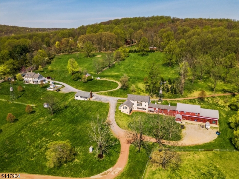 OPPORTUNITY ABOUNDS*LET YOUR IMAGINATION RUN! 27 acres Buildings laid out across the farm to resemble a village! Five buildings, 2 windmills, 6 car garage, Horse stalls+++ Hour from NYC & Philadelphia! Hope Hill Meeting Hall is waiting for someone to put their finishing touches onto it, such as an entrepreneurial or entertainment venue limited only by one's imagination! FANTASTIC MOUNTAIN VIEWS FROM EVERY BUILDING FROM ALL SOUTH FACING WINDOWS!! Main house has 6500sf 5 beds, 3.2 baths, high end appliances, hardwood floors throughout Two apts in lower level (2BR & 1 BR); Efficiency School House; 2 BR Ranch, Meeting hall has 3 finiished half bsths and plumbing for kitchen and Ice Cream Bar. Seller also has approved plans for 2 story building with four (4) car garage next to main home! Current Annual rental income is $60,000+/- VISION AN IMAGINATIVE WORKING ENTERPRISE, BUSINESS, LAW, ACCOUNTING, TECH PARK, CONFERENCE CENTER, CAR COLLECTION, WINERY, CAFE, EATERY, GENTLEMAN'S FARM, HORSES, SHEEP, ETC, CHEESE MAKING, ART/MUSIC/YOGA STUDIO, GYM, WEDDING VENUE, SOCIAL, SPIRITUAL OR LIVING COMPOUND!!
