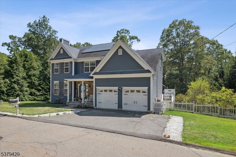 Welcome to this perfect, bright, beautiful home with gorgeous tasteful design elements and upgrades throughout. Exterior is cladded in Hardie board siding, stone facade on the front porch and great deck off the kitchen. Moving inside the first floor offers inlayed hardwood floors, oversized windows, gas fireplace in the LVR and flawless flow from room to room. Kitchen has all SS appliances, granite countertops, breakfast nook, large pantry with barn doors and access to the deck. To complete the first floor, the dining room has custom wainscotting, there is a laundry room off the kitchen for your convenience with access to the garage, and a generous powder room off the foyer. Second floor provides 4 bedrooms and main bath. Fantastic primary BR improvements include a shiplap wall, custom walk-in closet and amazing fully renovated bathroom with oversized shower, LED lighting and quartz dual vanity. Main bath has wood accent wall and offers an elegant vibe.  Continue down to the basement and there are endless opportunities to renovate the nearly 900 sq ft of potential. As if that is not enough the property is fully fenced in for your furry friends, and is professionally landscaped. Solar panel are paid off offering reduced electric at no cost to the buyer. See feature sheet in media for additional upgrades. This one is not to be missed.