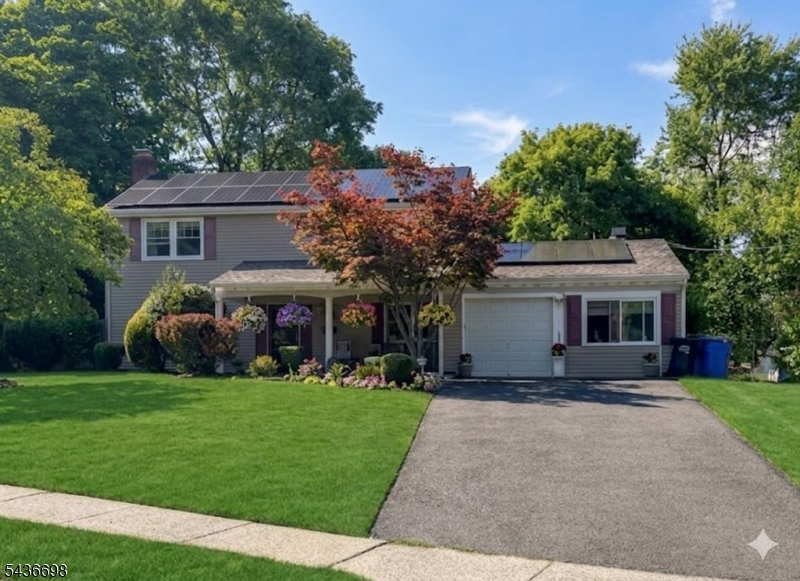Welcome to this spacious and expanded Colonial home featuring 6 bedrooms and 3.5 bathrooms, offering 2,328 square feet and a Rare opportunity for a private suite! Nestled on a quiet cul-de-sac, this home provides both privacy and a desirable neighborhood setting. The first floor welcomes you with a foyer, formal living room with a wood -burning fireplace, dining room, and two family rooms. This level also includes two bedrooms, a powder room, and a full bathroom. The open-concept eat-in kitchen and dining area create a bright and inviting space for everyday living and gatherings. The kitchen is equipped with granite countertops, stainless steel appliances, a breakfast bar and sliding glass doors that lead to a fenced backyard with a patio perfect for outdoor entertaining. A private suite on the first floor provides excellent flexibility for guests. It features a bedroom, full bathroom, family room, refrigerator, and a separate side entrance with direct access to the backyard. The second floor offers 4 spacious bedrooms and two full bathrooms. The expansive primary suite features 2 walkIn closets, a sitting area and a renovated full bathroom with double sink vanity creating a comfortable private retreat. Conveniently located near Rutgers University, major hospitals, shopping centers, public transportation, and major highways, this home offers both space and convenience. Don't miss this incredible opportunity, this is a must-see home!