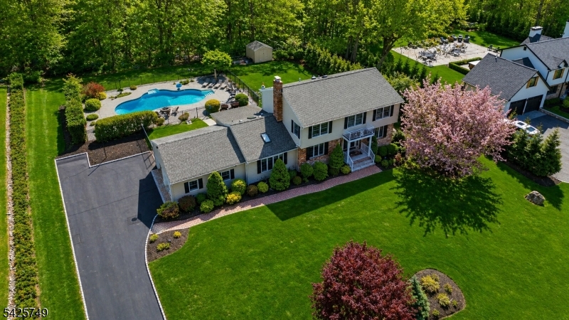 Back on market. Buyer unable to perform. Welcome to 112 Urban Club Rd, a beautifully reimagined Colonial set on nearly an acre of private property. This impressive home offers 4 Bedrooms, 3.1 Baths, a seamless blend of scale, design & function. Grand entry foyer opens to sun-filled living spaces featuring Andersen windows t/o. Show-stopping custom Kitchen is designed to impress, showcasing matte black cafe appliances, dual sinks w/prep station, refrigerated drawers, Caesarstone counters w/full backsplash, walnut shelving & large center island w/breakfast seating. The adjacent formal Dining Rm makes a bold statement w/herringbone wall detail, custom built-ins & designer finishes. A dramatic Great Rm w/soaring ceiling, exposed beams, shiplap accents & a sleek stucco wood-burning fireplace anchors the home. A 4-season Sunroom ideal for office or relaxation offer flexibility. The main level also includes a Mudroom w/built-in, Powder Rm & access to a 2-car garage w/epoxy flrs. Upstairs features wide plank oak floors, a Primary Suite w/ WIC & en-suite bath, 3 add'l Bedrooms & a recently updated main bath w/double vanity. The finished basement w/full Bath adds bonus 1100 sq. ft of living space, while the updated laundry rm has been thoughtfully elevated to include a large folding area & custom shelving. The backyard is a private oasis, an oversized pool, separately gated for added safety, plus multiple entertaining & lounge areas.