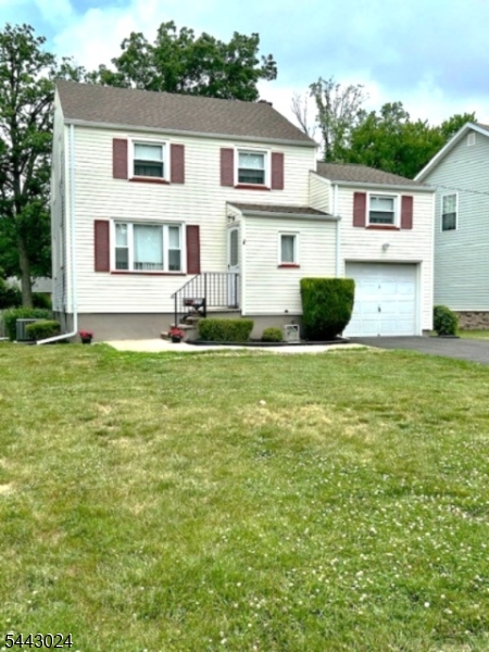 Located in a quite suburban neighborhood on a no outlet street, this Colonial has been lovingly maintained since it's construction.  Updates include Vinyl Siding, Thermopane Windows, Forced Hot Air furnace(5 yrs), Central AC(5yrs), new Roof(complete tear off and sheathing replaced) with Thermostat controlled attic fan,  interior totally painted, carpeting removed to expose oak flooring upstairs in the bedrooms and on the main floor.  The ground level features a bonus room off the Kitchen (heated and air conditioned too). The full basement is ready for use as a recreation room- freshly painted too, high ceiling and separated from the utility room.   For an easy commute, the home is conveniently located just a few blocks from public transportation( New jersey Transit train/Raritan Valley line), and Dunellen's Downtown , plus Columbia Park is nearby. Rear of property in a flood zone- house not in. Take the time to look at this home before it's too late.