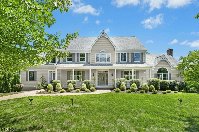 Welcome to this stunning Raritan Township Colonial offering 5 bedrooms, 5.5 bathrooms with exceptional living space. This impressive home features a beautifully updated gourmet kitchen complete with a large center island, granite countertops, breakfast bar, stainless steel appliances, and abundant cabinetry. The versatile floor plan includes a private first-floor in-law suite with a full bath separate exterior entrance, providing the perfect setup for extended living arrangements. Upstairs has 2 primary bedrooms with bathrooms and 3 secondary bedrooms offering flexibility and comfort for multi-functional living, guests, or those seeking a private retreat. The finished walk-out lower level expands your living space with high ceilings, a full bathroom, and endless possibilities for a home gym, office, or media room. Step outside to an expansive deck overlooking 2.78 picturesque acres, where breathtaking views create the perfect backdrop for entertaining or simply relaxing in your own private retreat. Additional highlights include a newer roof, public sewer, natural gas, multi-zone heating and cooling, and a prime neighborhood location just minutes from shopping, dining, and downtown Flemington. The home is also equipped with solar panels, providing significant energy efficiency benefits. A rare combination of space, updates, flexibility, and scenic beauty this exceptional home truly has it all.