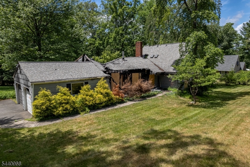 Exceptional land opportunity in the highly sought-after Sunset Lake neighborhood of Bridgewater. Set on a beautiful and private 0.82-acre lot, this property offers the perfect setting for new construction in an established residential area surrounded by higher-value homes. The existing structure sustained significant fire damage and is being sold strictly as-is. Home is not habitable and will require complete demolition. Value is in the land and premier location. Public sewer and public water available in the street. Ideal opportunity for builders, investors, or buyers looking to design and build a custom home. Conveniently located near top-rated schools, major highways, shopping, dining, parks, and commuter routes.Buyer responsible for all inspections, permits, certifications, and due diligence with the township. Do not approach structure.