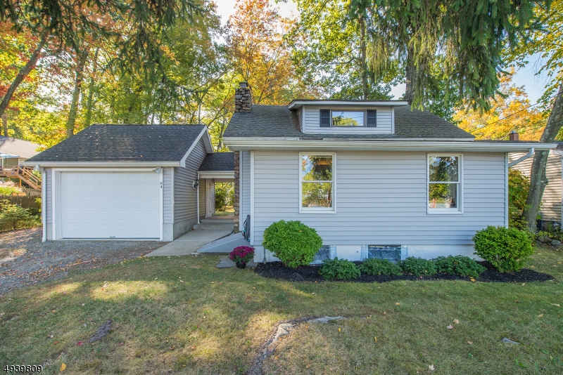 Prime Waterfront Location! Over 79 feet of waterfront plus bonus front row panoramic views of Indian Lake. Spectacular sunsets & easy access to Lake Life fun. Open living concept w/renovated oak kitch en & dining w/wall of windows to enjoy natural setting. The LR boasts HW flooring & a gorgeous stone WB fireplace. 1st floor bdrm w/full bath & washer/dryer. Upstairs offers 2 addtl bdrms & updated full bath. TONS of storage in bilco bsmt & oversized garage! Level lot & patio to enjoy a truly lovely spot. Indian Lake is a vibrant community- stocked for fishing, motor boating & many other watercrafts, swimming, 3 beaches w/lifeguards, tons of sports activities including volleyball, horseshoes, softball etc. plus a long list of traditions & events that make this a special place to live. Close to mass trasit & hwys.
