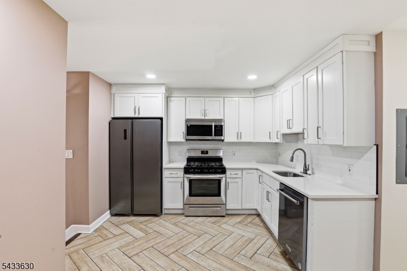 Renovated 2 Family with parking plus spacious basement with potential to finish. Central air and stainless steel appliances throughout  . 1st Floor vacant 3 beds 1 bath Market rent $2350-$2500. 2nd floor month to month rented 4 bedrooms 1 bath currently rented for $2600.  Close to highway and transportation Qualifies for $22k Grant