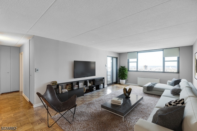 Experience Luxury Living at the Apogee, while getting your money's worth! This spacious 2 bed, 2 bath coop features countless modern updates! A large living/dining room greets you with tons of natural light! The kitchen has been newly renovated with high gloss cabinetry, a large island &stainless steel appliances! Both bathrooms have been updated with sleek vanities and modern subway tile! The unit is complete with a private terrace featuring stunning sunset views! This building features amenities galore, including 24 hr doorman & full service concierge, Olympic-sized heated swimming pool & hot tub, fitness center w new yoga/pilates studio, tennis courts, community room, playroom &more! Monthly HOA includes amenities, taxes, water & cable/internet. PHOTOS VIRTUALLY STAGED