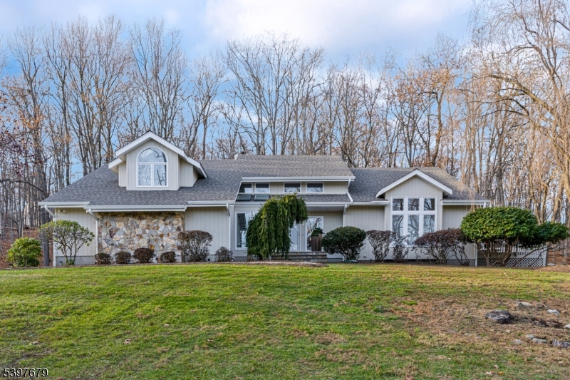Rare opportunity to own a stunning custom contemporary home w striking architectural design that sits on 5.6 acres of peaceful woodland the perfect setting for those seeking privacy & land to truly enjoy.Home offers peace of mind with NEWER ROOF(2022), NEWER AC & furnace(2023-2024) & whole house generator; it's in mint condition & has exceptional updates throughout.It features a freshly painted neutral color palette & thoughtfully selected finishes, reflecting superior taste in interior design to create an elegant & inviting atmosphere thru/o  A stately 2 story foyer & soaring vaulted living room w iron balusters & walls of windows create a dramatic first impression while filling the home with natural light.The open floor plan highlights a stunning kitchen with an oversized center island, stainless steel appliances & dining area overlooking picturesque wooded views.Entertain effortlessly with access to a huge deck & large patio for outdoor gatherings. Step-down family rm has fireplace & butler's pantry style area provides the perfect place to relax.Ascend to the 2nd flr to the impressive primary suite featuring a balcony overlooking peaceful nature & very large bath w dual vanity, soaking tub,stall shower & beautiful palladium window. 3 additional bedrooms & a full bath complete the level.Finished basement offers flexible bonus space for recreation.Possible subdivision; please confirm w Twsp. Jjust mins to major roadways Routes 10,45.206 & 80. MULTIPLE OFFERS RECEIVED