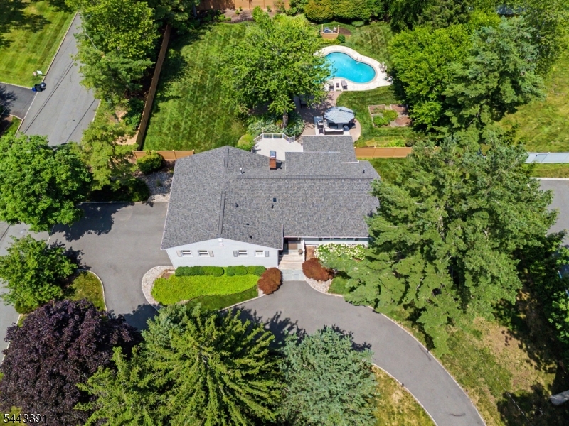 TRUE RESORT-STYLE Living in PRESTIGIOUS COVENTRY on a GORGEOUS .83 acres featuring a HEATED In-Ground Pool, Expansive Paver Patio, and a HUGE PLAYABLE Backyard. This SPACIOUS Custom Split offers over 3,600 sq ft of Living Space, including TWO En-Suite Bedrooms PLUS a Finished Basement. Designed for effortless entertaining, the Main Level showcases a Banquet-Size Dining Room, Formal Living Room, and Eat-In Kitchen with Center Island and Designer SS Appliances. The BRIGHT Family Room ADDITION spills out to a Deck overlooking the PRIVATE Backyard OASIS and POOL. The Second Level hosts Primary En-Suite with a Double Vanity Bath and TWO Walk-In Closets. The Private Third-Level En-Suite PRINCESS Bedroom offers an Updated Full Bath and Walk-In Closet.  The COZY Lower Level features a Second Family Room with a Gas Fireplace and convenient Walk-Out to the patio and pool area. The Finished Basement includes a Recreation Room, Laundry Area, and ample Storage Space. LIFE is GOOD in LIVINGSTON!