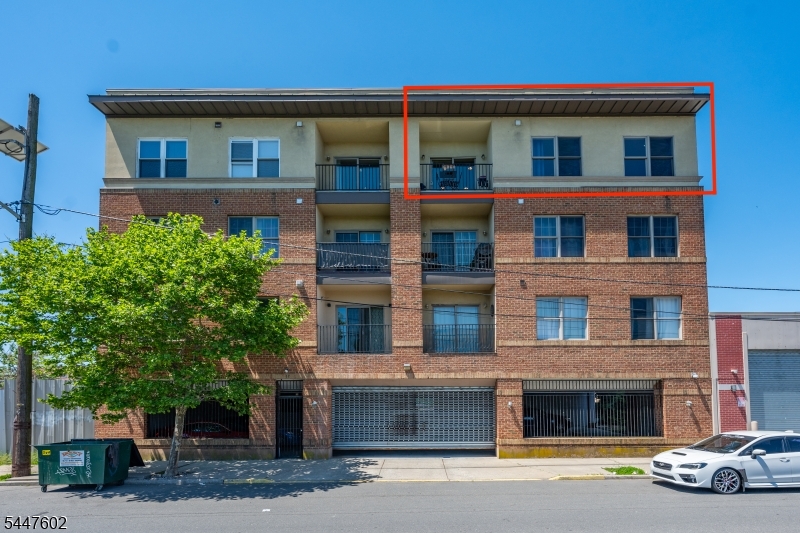 Welcome to this beautifully maintained top-floor condo offering comfort, convenience, and scenic views from your private balcony. This spacious 3-bedroom, 2-bathroom home has central air and heat plus an open concept living space filled with natural light. This building is ideally situated near major commuter routes, shopping, dining, and public transportation, making it an excellent opportunity for homeowners or investors alike. The primary bedroom includes a private bathroom and scenic views of the famous NYC and Newark skylines. The eat-in kitchen comes equipped with a gas range/oven, refrigerator, and dishwasher. Enjoy the convenience of a full-size washer/dryer in unit alongside ample storage space.Residents will also appreciate the security and convenience of an assigned parking space with gated garage door opener access with additional street parking available. The building also offers CCTV security monitoring throughout common areas and surrounding exterior spaces for added peace of mind.A rare opportunity to own a top-floor condo with views, parking, and modern comforts in a convenient Newark location - a must see!