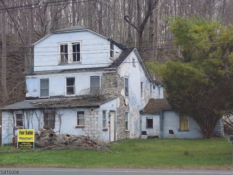 390 feet of highway frontage great for any business use, the building used to be a stagecoach stop then was a restaurant then a 2-family home it has a lot of historical value and is a solid 2 feet thick rock walls, 2 fireplaces, lots of potentialpresent all offers