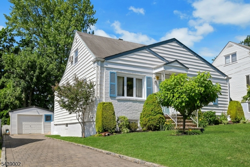 Location! Just minutes from Montclair State University, this very well-maintained home offers comfort, convenience, NYC & Skyline View from the Driveway, Front Yard & 3rd Bedroom. Step inside to find hardwood floors throughout 1st floor, a bright living room, and a formal dining room. The updated eat-in kitchen features a stainless steel double-door refrigerator & dishwasher, offering plenty of space for cooking and gathering, with an access to the backyard and driveway. The main level also includes a primary bedroom, a second bedroom with access to the enclosed porch, and a renovated full bathroom with a bathtub. Upstairs, you'll find a spacious third bedroom with New York City Skyline Views, along with a versatile den that can be used as a home office, guest room, or potential fourth bedroom to suit your needs. Additional features include a full unfinished basement with a washer and dryer, abundant storage space, a detached oversized one-car garage, and a long inter block driveway fits tandem 3-4 cars. The professionally landscaped front and backyard, along with private patio, create a wonderful outdoor retreat perfect for summer barbecues, entertaining, gardening, or outdoor enjoyment, and an unbeatable location, this charming home offers a rare opportunity just minutes from Montclair State University, shopping, dining, parks, and public transportation. Commuters will appreciate the easy access to major highways, including I-80, Route 46, 19, 20, and Garden State Parkway.
