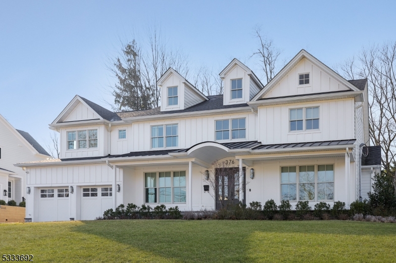 This stunning home features 7 spacious bedrooms & 6.1 baths across four beautifully designed floors. Upon arrival, you are greeted by a covered front porch that invites you into the foyer. To one side, a FDR w/butler's pantry, wine refrigerator & wet bar offers an elegant space for entertaining. On the other side, a formal living room opens to the family room boasting a gas FP, custom ceiling details & French doors to the back deck. The state-of-the-art kitchen offers a center island breakfast bar, quartz countertops, SS appliances & inset shaker cabinetry complemented by a pantry & separate breakfast room. A 1st floor en-suite bedroom/office with cathedral ceiling, mud room & powder room complete the main living level. The 2nd floor expansive primary bedroom suite features a tray ceiling, dual WICs & luxurious bath w/soaking tub & shower. Additionally, there are two Jack-and-Jill bedrooms w/full bath, addl bedroom, full hall bath & convenient laundry room w/built-in cabinetry. The finished 3rd floor provides more living space, with a bedroom, full bath & spacious bonus room to suit any need. The finished bsmt is equally impressive, offering a guest bedroom, full bath & sprawling open area perfect for relaxation or entertaining.Outside, the prof landscaped grounds incl a fenced backyard, Trek deck & 2-car attached garage, rounding out this incredible property. Every detail has been thoughtfully designed to offer both luxury & comfort, making this a truly exceptional home.