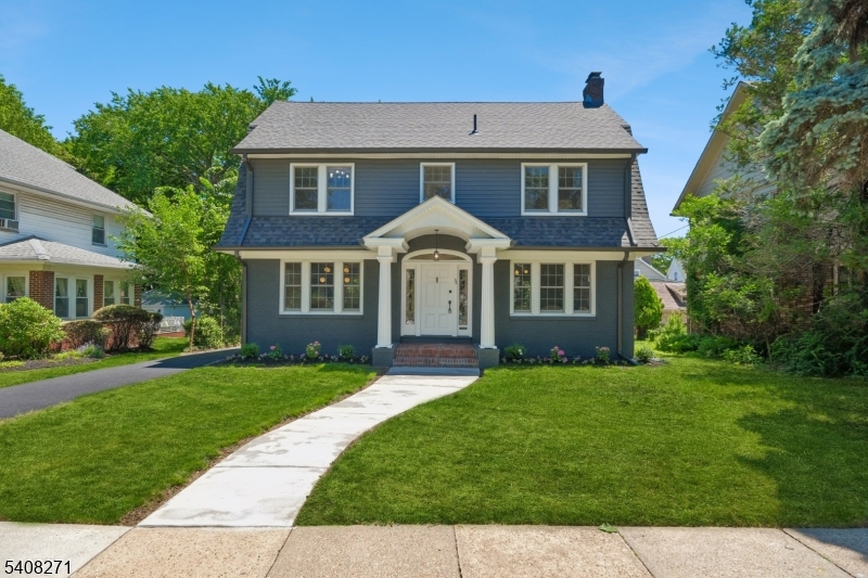 Move right in and enjoy this beautiful Tuxedo Park colonial which has been thoughtfully updated to blend modern amenities and timeless period details in a truly turn-key package. Polished refinished hardwood floors, a neutral paint palette and stylish modern lighting set the stage across a flowing floorplan and light-filled and spacious rooms. Enter through a French door into a wide foyer with openings to the dining room and living room with fireplace flanked by built-in bookcases. A sunny family room is a cozy spot to unwind and relax or use as a 1st floor office space. The modern kitchen will delight with warm wood-toned cabinetry, quartz counters and breakfast bar, tile backsplash and Samsung appliance package. Upstairs, find bright bedrooms plus office space/sitting room set across the upper levels. The primary bedroom features a walk-in closet and full bath with double sink vanity and a large shower with handheld and rain shower fixtures and glass doors. The lower level offers bonus additional flex space and storage. Outside, the pretty property is framed by mature trees. 2026 updates include new kitchen and baths, new roof, new gutters and new siding, repaved driveway, new central air, refinished hardwood floors, freshly painted in/out, improved landscape and more. Tuxedo Park is a quiet, established neighborhood with tree-lined streets and stately period homes within easy reach of vibrant South Orange Village. Convenient commuter  jitney to NYC trains on the corner!