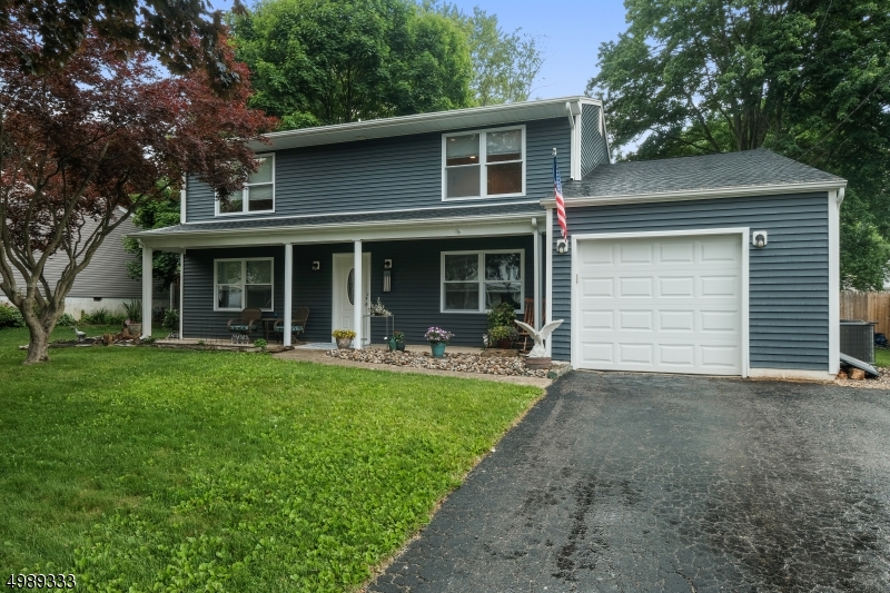 Almost brand new, this house was completely rebuilt in 2016 after a fire. This colonial was completely rebuilt in 2016 after a fire. An inviting front porch welcomes you in to the entry foyer. The first floor offers a living room with gas fireplace, dining room, family room leading out to patio, laundry/mud room leading to the garage, powder room and wonderful kitchen. The kitchen features tile floors, granite counter tops, quality custom wood cabinetry and stainless steel appliances.  The second floor has a master suite with full bath, 2 closets plus walk in storage space, three other bedrooms and a full bath. Back yard is fully fenced, flat, and private with a lovely patio area.