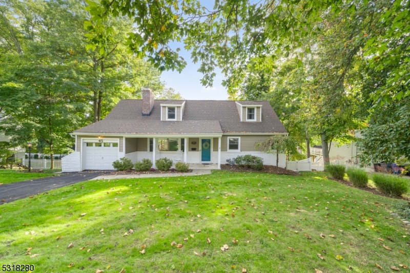 Exceptional expanded Cape with rocking chair front porch located in the extremely desirable Washington's Headquarters neighborhood. This four bedroom, two full bath home with a large finished basement leaves nothing to be desired. The main floor offers an open and inviting floor plan. A large living room with oversized fireplace welcomes guests to the home. The open dining room and kitchen is ideal for entertaining with peninsula for additional seating and slider to the large deck. A one-car garage connects conveniently off the dining area. There is an updated full bathroom as well as two bedrooms on the level. Upstairs is another bedroom, full bath room and large primary. The primary offers several closets including a walk-in and tasteful exposed brick. The finished lower level was recently renovated and has another fireplace with wood burning stove, bonus room, laundry and unfinished storage space. The lower level has tons of natural light and a walkout to a large paver patio. Outside the deck overlooks the large, fully fenced yard, ideal for pets. There's a newer shed as well for additional storage. Close to Downtown, spectacular dining establishments, train, shopping, Mayo Performing Arts Center, and so much more 45 Washington Ave should not be missed.
