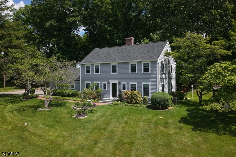 This recently-updated, upscale hobby farm is nestled in a retreat-like setting in the heart of Tewksbury on a winding scenic road. Comfortably-scaled with an open floorplan, solid oak floors throughout, and oversized windows overlooking bucolic views of the property, the home's recent high-end renovations include the kitchen, all bathrooms, primary bedroom tray ceiling, mudroom, first-floor laundry/pantry, and hardscaping. The finished basement adds additional living space with recreation room, gym, and/or home office possibilities and includes a secondary laundry area. Other newer upgrades to the home include siding, windows, roof, and a stationary generator. The equestrian/livestock facilities on the property include a 4-stall barn with wide center aisle, paneled tack room, wash stall with hot and cold water, large hayloft, small livestock paddock, a large grassy field suitable as a horse pasture with the addition of fencing, and a large, stonedust riding ring conveniently located between the barn and a sylvan buffer discreetly separating the horse facilities from the home. The oversized parking area near the home provides access to the home and barn area by way of a picturesque gravel pathway. Tasteful updated hardscaping and recent newer plantings complement established landscaping providing a mix of sunny and shaded areas throughout the property. Conveniently located near the Tewksbury Trail system, with easy access to Tewksbury schools, shopping and commuting highways