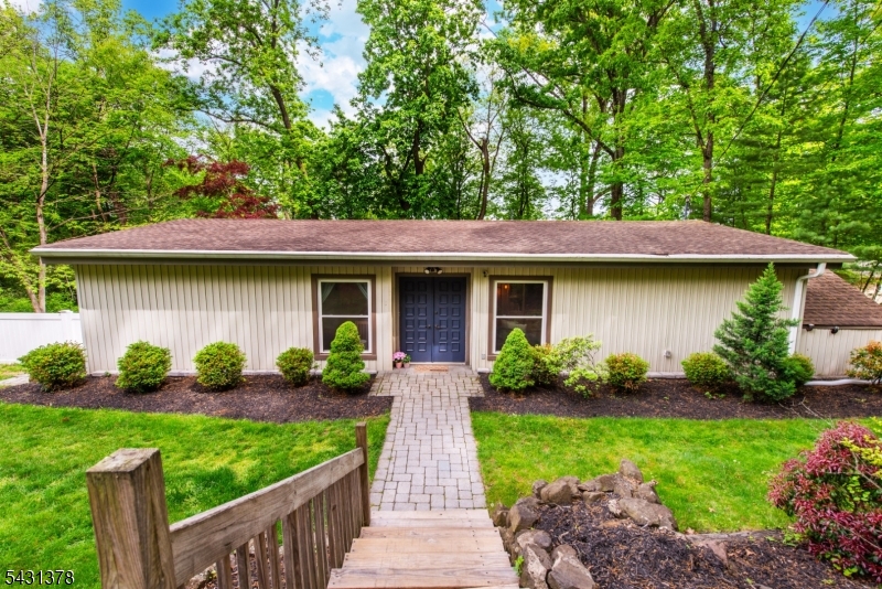 Nestled in the desirable Towaco section of Montville, this lovingly maintained 3-bedroom ranch blends charm, comfort, and thoughtful updates throughout. Step inside to an inviting open-concept layout, perfect for everyday living and effortless entertaining. The updated kitchen flows seamlessly into the dining area, featuring beautiful laminate flooring and direct access to your private backyard retreat. Backing to mature woods, the expansive deck and lush property create the ideal setting for outdoor gatherings or quiet evenings surrounded by nature. Recent improvements include a newer roof, updated flooring, updated kitchen, and a beautifully renovated bathroom that adds a fresh, modern touch. Set on a generous .62-acre lot, this move-in-ready home is ready for its next chapter.