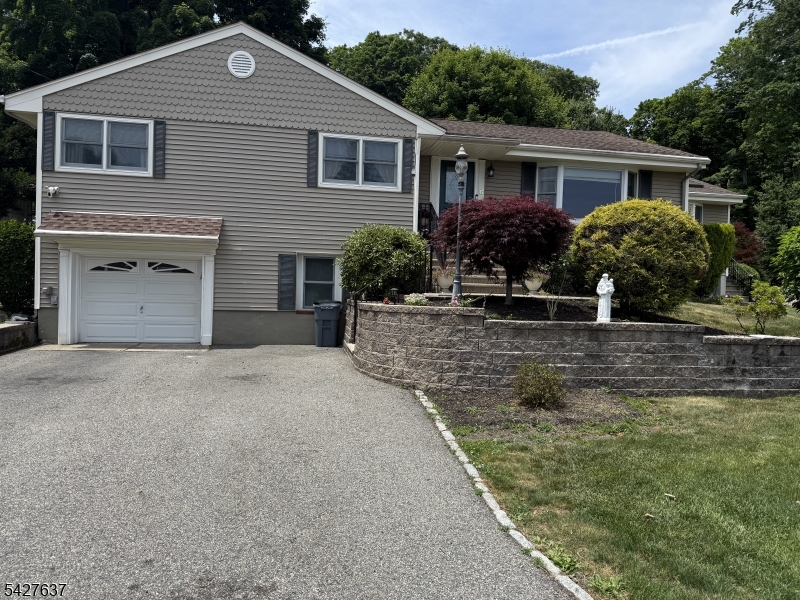 Welcome home and welcome to a slice of paradise. Feel like you're on vacation every day in this beautifully maintained 3 bedroom (possible 4th bedroom) 2 full bath home that has been meticulously cared for and holds years of memories. With spectacular lake views and located on a cul de sac this is a one in a million find in beautiful Fayson Lakes. Large living room, separate formal dining room, large eat in kitchen, bonus room with double doors off of the dining room, this is your first and last stop. Main bath and 3 bedrooms on the first level, 2 large rooms on the lower level with possible 4th bedroom, office/den and full bath, entrance to garage, workshop and laundry room. Beautifully landscaped property and did we mention THOSE VIEWS? Get ready to unpack. This home has held countless years of happiness and memories and now it's time for new owners to make their own, all while enjoying all that Fayson Lakes has to offer. Beaches, swim club, clubhouse, tennis, volleyball on the beach, fishing, boating and a community that once you're here, you don't want to leave. All of this plus Kinnelon's top rated school system, close to transportation, 30 minutes from NYC, close to county parks, golf courses and restaurants. MAKE THIS YOUR FIRST AND LAST STOP. WELCOME HOME!