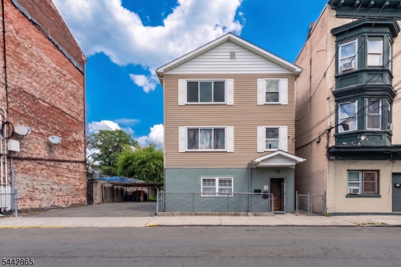 Excellent opportunity for owner-occupants or investors! This well-maintained East Side Paterson property features 8 spacious bedrooms, 5 updated bathrooms, separate utilities, and functional layouts designed to maximize rental potential. Enjoy updated interiors, a fenced front yard, and close proximity to Route 80, Route 20, NJ Transit, shopping corridors, laundromats, schools, and everyday conveniences. Located within Paterson's Eastside Redevelopment District.