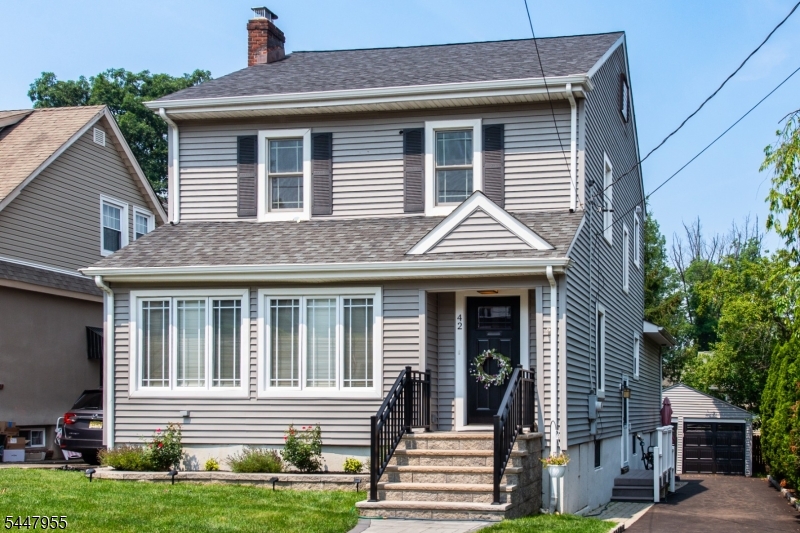Look no further! This A+ Laning school district colonial will wow you on every angle! With gleaming redone hardwood floors, along with a cozy fireplace & molding & trim throughout, character & charm abound! All complemented by a spectacular updated kitchen/family room/full bathroom addition that boasts cherry wood cabinets, stainless steel appliances, granite countertops, & a breakfast bar-the perfect open floor plan for today's buyer! Three generous sized bedrooms and a recently redone full bathroom await you on second floor.Don't miss the 3rd floor walk up attic for unlimited expansion possibilities! Enjoy coffee or cocktails on your trex deck or enclosed front porch.Full basement affords opportunities for playroom,rec room,exercise room or office-your pick!Brand new lawn & two car garage.Fully insulated split units throughout the home for your comfort.Just a stone's throw to acclaimed Verona Park, restaurants,shops, & NJ Transit bus.A hop skip jump to all that Montclair has to offer-the Wellmont Theatre, Montclair Film Festival & S Mountain Art Museum.Be in for school to start if desired! This one won't last!