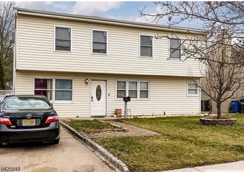 Well-maintained bi-level home featuring 5 bedrooms and 2 full bathrooms, located at 62 Leber Ave in Carteret, NJ. This spacious property offers a comfortable living/dining room combination, providing a functional layout for everyday living. Conveniently situated near major transportation routes including I-95, Route 27, and the NJ Turnpike, making commuting easy. Close to shopping destinations such as P.C. Richard and Walmart. Seller is highly motivated don't miss this opportunity!