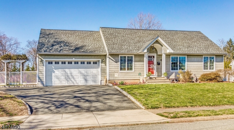 Welcome home! This renovated 3 bedroom cape features an open concept kitchen and living room with high ceilings and plenty of entertainment space. First floor master bedroom with fresh hardwood floors and a walk-in closet is sure to please.  An abundance of storage can be found in the two car garage, partially finished basement, and shed in the backyard.  Yard is level and completely fenced, with a paver patio, conveniently located near Rte 23 & Wayne Transit Center.