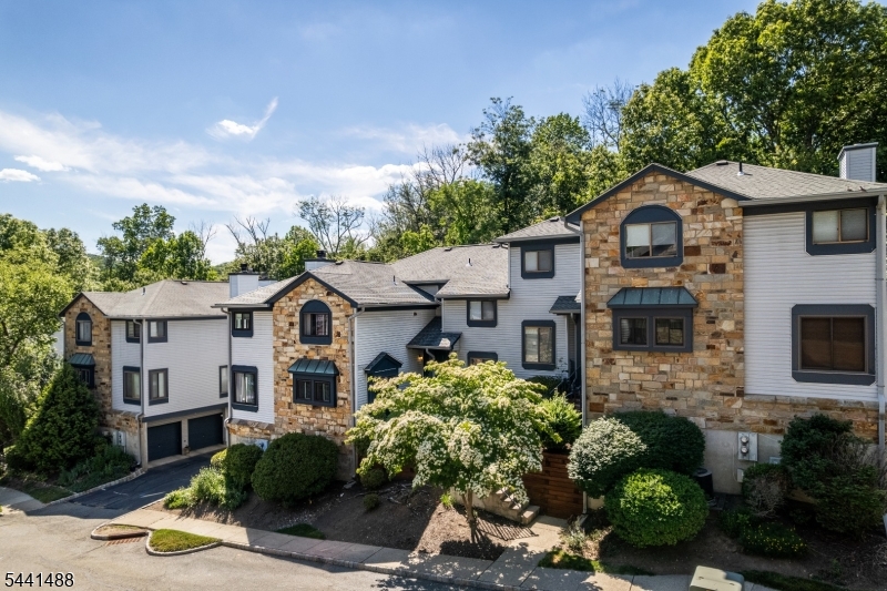 Welcome to The Hills of Independence! This beautifully maintained 2-bedroom, 1.5-bath townhome offers comfort, style, and convenience in one of Independence Township's most desirable communities. The updated kitchen features white cabinetry, granite countertops, stainless steel appliances, including a smart refrigerator, and a stunning tile backsplash.The spacious living room is highlighted by a cozy wood-burning fireplace, perfect for relaxing or entertaining. Upstairs, you'll find two generously sized bedrooms, including a spacious primary suite with dual closets and direct access to a beautifully renovated Jack-and-Jill bath. The second bedroom also enjoys direct access to the bath, creating a functional and versatile layout.Step outside to your private balcony and enjoy peaceful surroundings, morning coffee, or an evening drink. Tucked away in a quiet setting, this home offers a wonderful sense of privacy rarely found in townhome living.Major updates include a 2-year-old furnace and central air conditioning system. Residents enjoy access to community amenities including a clubhouse, swimming pool, playground, and park area.Conveniently located near shopping, dining, recreation, and major commuting routes, this move-in-ready home offers low-maintenance living in a picturesque community. Whether you're a first-time buyer, downsizing, or seeking a carefree lifestyle, this inviting townhome is one you won't want to miss.