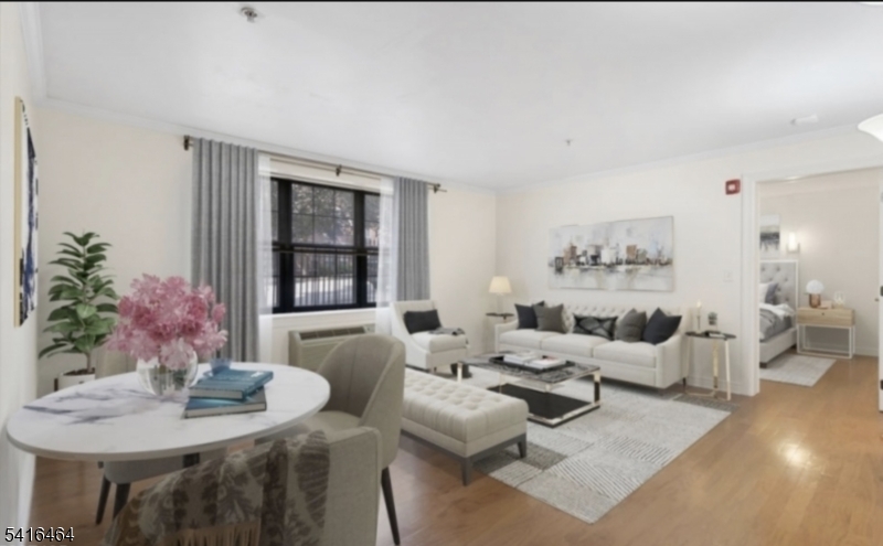 Experience the perfect blend of convenience, style, and safety in this meticulously crafted 1-bedroom, 1-bathroom unit, located just steps from Morristown's vibrant Green. Built by the award-winning Developers, this exceptional building showcases unparalleled attention to detail, premium quality, and top-tier safety features, including a secure intercom entry system with wireless key access, two-hour fire-resistant construction, a Cummings generator, and state-of-the-art elevators. Inside, you'll find a spacious bedroom that provides ample room complete with a generous walk-in closet for all your storage needs, and beautifully designed bathroom. The kitchen features sleek stainless steel appliances and Ceasarstone countertops, ideal for both cooking and entertaining. Gleaming hardwood floors flow throughout the living and dining areas, adding warmth and sophistication. Additional conveniences include an in-unit washer and dryer for effortless living. Residents enjoy access to a range of premium amenities, including mandatory off-street parking, on-site storage, and a fully equipped exercise room. All of this is set in a quiet, desirable neighborhood, offering both tranquility and proximity to Morristown's premier dining, shopping, and entertainment. Don't miss this opportunity to live in one of Morristown's most sought-after developments