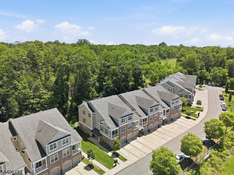 Like-new townhome in a sought-after Morris County location ? move-in ready and meticulously maintained from top to bottom. This stylish 3-bed, 2.5-bath end unit offers the space and flexibility today's buyers are looking for, whether you're commuting to the city or working from home. Enter into a welcoming foyer with direct garage access, then head up to the main living level where hardwood floors transition to a bright, open living and dining area, galley kitchen with breakfast bar, powder room, and a private balcony ? perfect for morning fresh air  or unwinding after a long day. The upper level features well-planned primary suite with walk-in closet and full bath, plus two additional bedrooms ?one with treetop views, one with a walk-in closet ? a full hall bath, and a dedicated light bright laundry room. Freshly painted and professionally cleaned throughout ? truly turnkey. Low maintenance fee and low taxes make this an exceptional value. Floor plan in media section. Close to major shopping, commuter train lines, and key highways. Don't miss this Waterview in Cedar Knolls unit.
