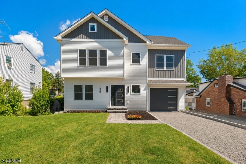 Welcome to 136 Lake Shore Dr in Lake Hiawatha, a brand new rebuilt 5-bedroom, 2.5-bath home with a truly one-of-a-kind contemporary design. From the moment you step through the front door, the home opens to a breathtaking view of the main living space, showcasing an impressive open layout, clean architectural lines, and a dramatic modern feel throughout. The kitchen offers excellent function and style, including a huge pantry space tucked just off to the side for added storage and convenience. The primary suite is a standout, featuring a massive walk-in closet and an oversized primary bathroom designed with comfort and luxury in mind. A new deck extends the living space outdoors, while the generous attic offers excellent potential for storage or future flexible use. Conveniently located near Lake Hiawatha shops, dining, parks, and commuter routes, this magnificent rebuilt home offers space, style, and presence in one impressive package.