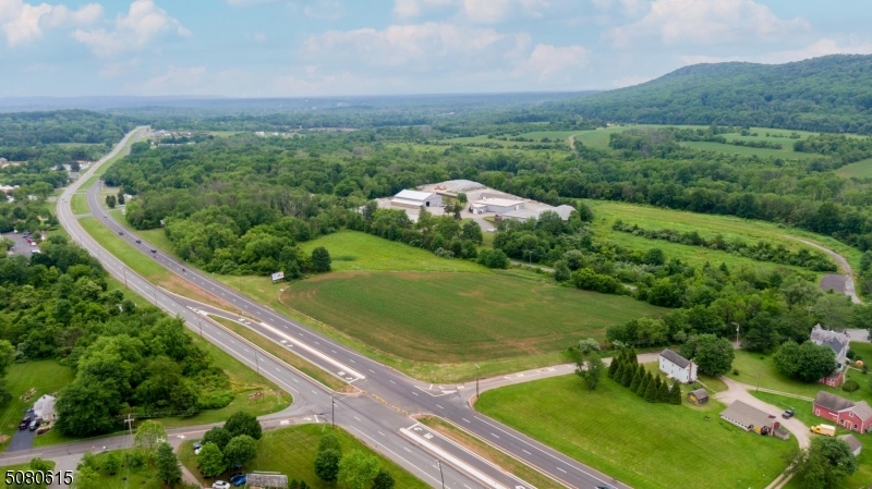 Fantastic location w/many possibilities! Located in C-ROM zone. 14.5 a w/frontage on 3 roads - Rte. 22E (1250'), Main St. (1402') & Blossom Hill (461').  Portion in FLA. 2 billboards provide income.  Possible water & sewer hook up - Purchaser to ascertain.