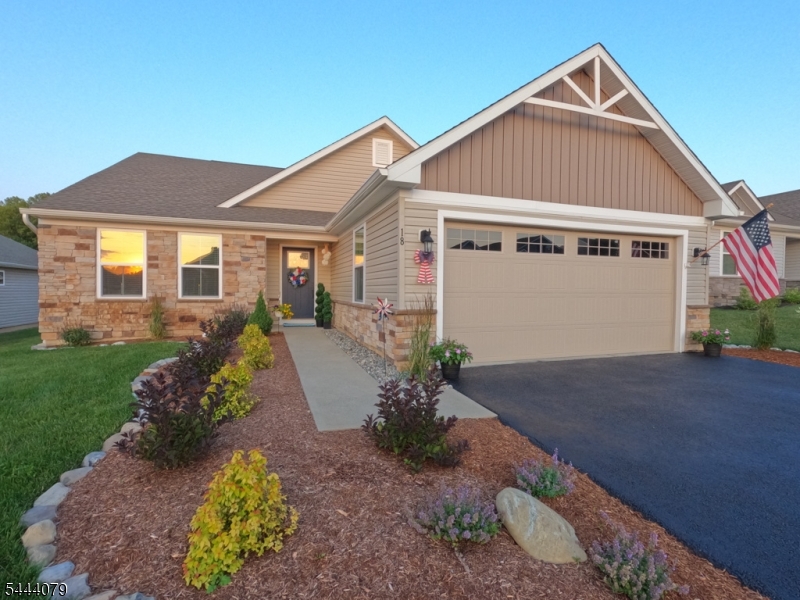 Move-in ready Ranch style home built in 2020 offers an open concept floor plan, eat-in kitchen, covered patio with slider access, 18kW whole house generator (2025), LVP flooring (2025), and fresh paint throughout (2025). Spacious primary bedroom features ensuite bath and generous walk-in closet with dedicated laundry conveniently located in adjacent hall. Stainless steel appliances, granite countertops, center island, and pantry in the kitchen flow into spacious dining area and family room drenched in natural light. Two additional bedrooms and hall bath with tub off the foyer provide room for guests or home office. No detail was spared in recent improvements down to the professional landscaping in both front and rear yards (2026). A true charmer atop the mountain steps away from the amenities of Grand Cascade Lodge in Crystal Springs Resort featuring fine dining, golf course, spa, pools, and sports club. HOA provides low maintenance living with snow removal, sidewalk and walkway shoveling up to front door, and lawn/sprinkler maintenance. Home also boasts attached 2 car garage, natural gas, public water/sewer, instant hot water, and 4-year transferable builder's warranty. Desirable locale, picturesque views, meticulous care, and mountain serenity all located at 18 Lam Drive - RUN don't WALK!