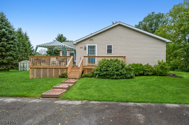 Come out to your home in the heart of the country! Ranch style living in a young beautifully maintained house. This home features a cozy sunroom and large deck on which you can relax and enjoy the peace, quiet and privacy of this large beautiful scenic 1 acre property.Updated Kitchen with Oak cabinets and Quartz countertops. Hackettstown mailing address.