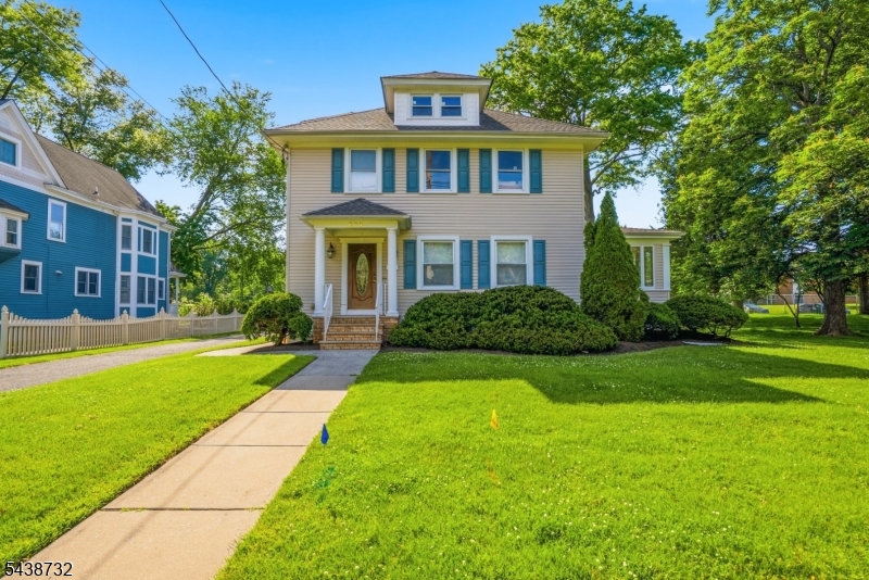 Beautiful, updated Colonial with large rooms and high ceilings, conveniently located minutes from town, train, school, and library!  Spacious first floor features living room, dining room, family room with gas fireplace, powder room, and kitchen, with great hardwood floors, woodwork, and built-ins. Plus a bonus 4-seasons room.  Eat-in kitchen has granite counter tops, abundant cabinet space, and stainless steel appliances.  Upstairs you will find four bedrooms, large full bath, and walk up attic perfect for easy storage. Laundry in the basement.  Parking in private driveway with detached garage. Extended yard with lots of room to play.  Just blocks to Cranford's award winning downtown with shops, restaurants, and local amenities.