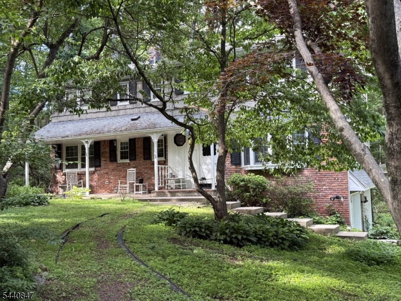 Spacious 4-bedroom Colonial offering exceptional living space, thoughtful updates, and endless possibilities. Nestled on a beautifully landscaped, private property, this home features a welcoming front porch, enclosed rear porch, and generous backyard ideal for outdoor enjoyment. The updated kitchen is equipped with Corian countertops, stainless steel appliances, and a wall oven. Additional improvements include an updated septic system, central air conditioning, and hot water baseboard heating. Hardwood floors extend throughout the home, including all bedrooms, complemented by large room sizes and abundant storage. The expansive basement provides flexible space for recreation, hobbies, a workshop, or future finishing and offers direct access to the attached 2-car garage. Conveniently located near Routes 15, 80, and 23, with access to NYC transportation, shopping, dining, schools, and houses of worship. A wonderful opportunity to customize and make this home your own.