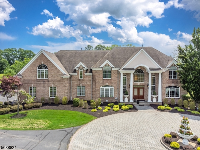 Exceptional Private Country Retreat on 12+ Level Acres. Gated entry and a tree lined driveway lead you to this Majestic Colonial. Entire property is fenced-in ! 6097 Sq Ft plus a superb finished basement. Brick front w/Columns and a grand foyer w/a Butterfly Staircase. A chefs kitchen w/center island & a breakfast bar ! Spectacular Eat-in-Area w/volume ceilings and a gas fireplace. Great room has soaring ceilings & a Wood burning F.P. 1st floor Bedroom & Full bath. Master suite w/high ceilings, sitting area w/balcony, double sided F.P., large master bath and walk-in-closet w/built-ins. 3 Additional bedrooms w/high ceilings and attached full baths. Luxurious walkout Lower Level has an office, Gorgeous wet bar, Movie theatre, Bedroom + Full bath & More. Stunning Backyard offers an oversized pool, waterfall, Pond, Outdoor Kitchen. New Features in this home include 3 New Bathrooms, New Full House Gas Generator, Less than 2 years old 4 units of heating & cooling, New Driveway, New roof on the outdoor kitchen. A Must See !!