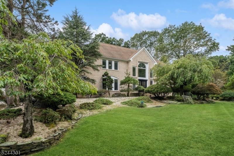 IMPRESSIVE!  Beautiful, light, and bright colonial with inviting curb appeal in a great location featuring: five bedrooms, four bathrooms, fenced in level yard with an in-ground swimming pool and spa is waiting for you!  Grand entry to spacious foyer with bridal stair case and granite floor will lead you into this special home.  First floor offers an updated kitchen with stainless steel appliances including wine cooler, an island, granite counter tops, breakfast bar opening to the deck; dining room, two story family room with a wet bar and a two-sided wood burning fire place, office, sunroom, a bedroom, full bathroom, and a laundry room.  Second floor landing will lead you into a master suite featuring sitting room, luxurious bath with double vanities, jetted tub, and a shower; two walk-in closets.  Three additional, spacious bedrooms, two bathrooms complete the second floor. Oversized windows allow an abundance of natural light to flood the space!  There are mostly hardwood floors, moldings, and so much more!  Huge unfinished basement provides plenty of opportunities! Fenced in, very private backyard with inground pool and spa are perfect for entertaining!! Koi pond was never used by current owners and are offered As Is without any known defects.   HVAC 4 years old.  Come and see for yourself!
