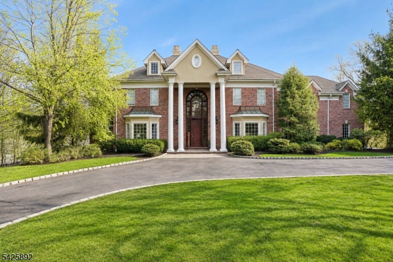This spacious & elegant Colonial has been extensively updated and upgraded with thoughtful improvements on every level. The first-floor living spaces have been opened to create exceptional flow, complemented by hardwood floors and a sleek, designer aesthetic throughout. From the new wine cellar and updated appliances including ovens, refrigerator, AC, and water heater to the exterior pool automation and new irrigation system, this home offers the perfect blend of modern convenience and timeless comfort, tucked away on a private cul-de-sac.Set on 1.5 beautifully landscaped acres, the property delivers an exceptional outdoor lifestyle. Enjoy a heated gunite pool with upgraded bluestone decking, hot tub, waterfall, expansive decks, and a dedicated sports court that will delight any basketball enthusiast. The grounds feel like a private resort designed for both entertaining and everyday relaxation.Located in Watchung, this home offers the rare combination of peaceful suburban living without sacrificing convenience. Surrounded by nature, gently wooded hills, and larger residential properties, the area is known for its highly rated schools, scenic parks and trails, and easy access to shopping, dining, and major commuter routes throughout Central and North Jersey. Residents enjoy the charm of suburban living while remaining firmly connected to the greater NYC orbit; making Watchung an ideal destination for those who want space, privacy, and nature alongside everyday accessibility.