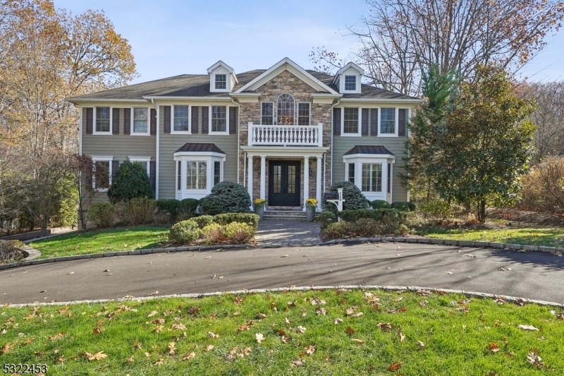 Built in 2008,  this stunning Colonial located in the Hartshorn section redefines sophistication and elegance.   6 bedroom, 6.1 bath, oversized three car garage and circular driveway is surrounded by its beautifully landscaped property. This home boasts impeccable craftsmanship, soaring ceilings, and abundant natural light. Its gourmet chef's kitchen features top of the line stainless steel appliances and opens seamlessly into a grand family room with built-ins,  sliders to the expansive deck that overlooks the backyard.  A circular flow into the formal living room, formal dining room, butler's pantry is perfect for entertaining. There is also a first floor bedroom en-suite and huge laundry room / mud room with built-ins.  The spacious primary suite is a private oasis with a spa-like bathroom,  custom walk-in closets and office/bedroom.  In addition, there are four bedrooms on the second level.  The walk-out lower level provides a recreation room, full bathroom, exercise room, mud room, and lots of storage.  Take advantage of all this community has to offer.  Enjoy the comforts of home and close proximity to the Hartshorn elementary school, Top-Rated Millburn Schools, Gero Park, Mid-Town Direct Train into NYC and Millburn downtown shops.